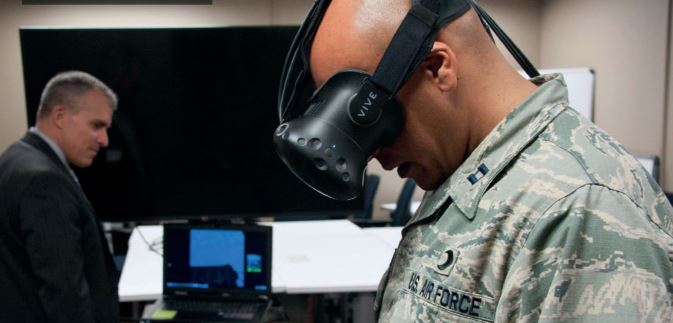 Soldier wearing virtual reality goggles
