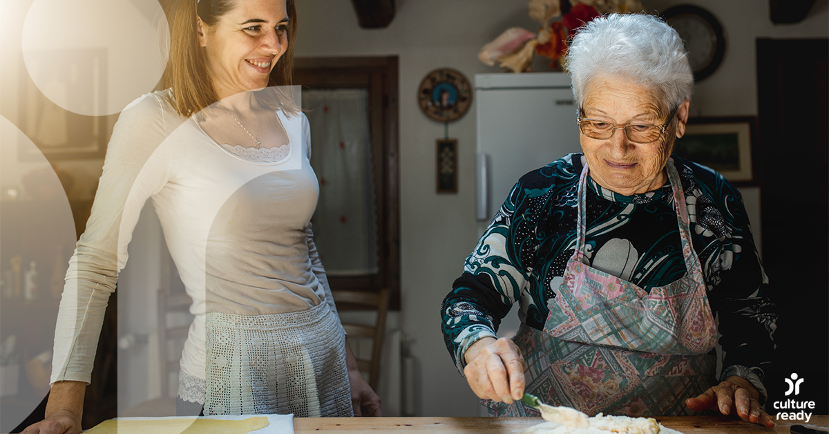 Young woman and older woman making pasta together.