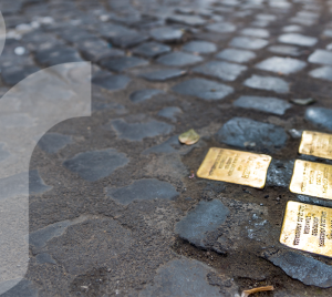 Close up of golden Holocaust memorial "stumbling stones"