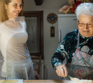 Young woman and older woman making pasta together.