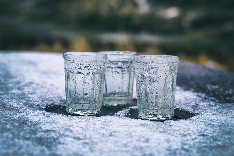 Empty glasses frosted over on a table outside