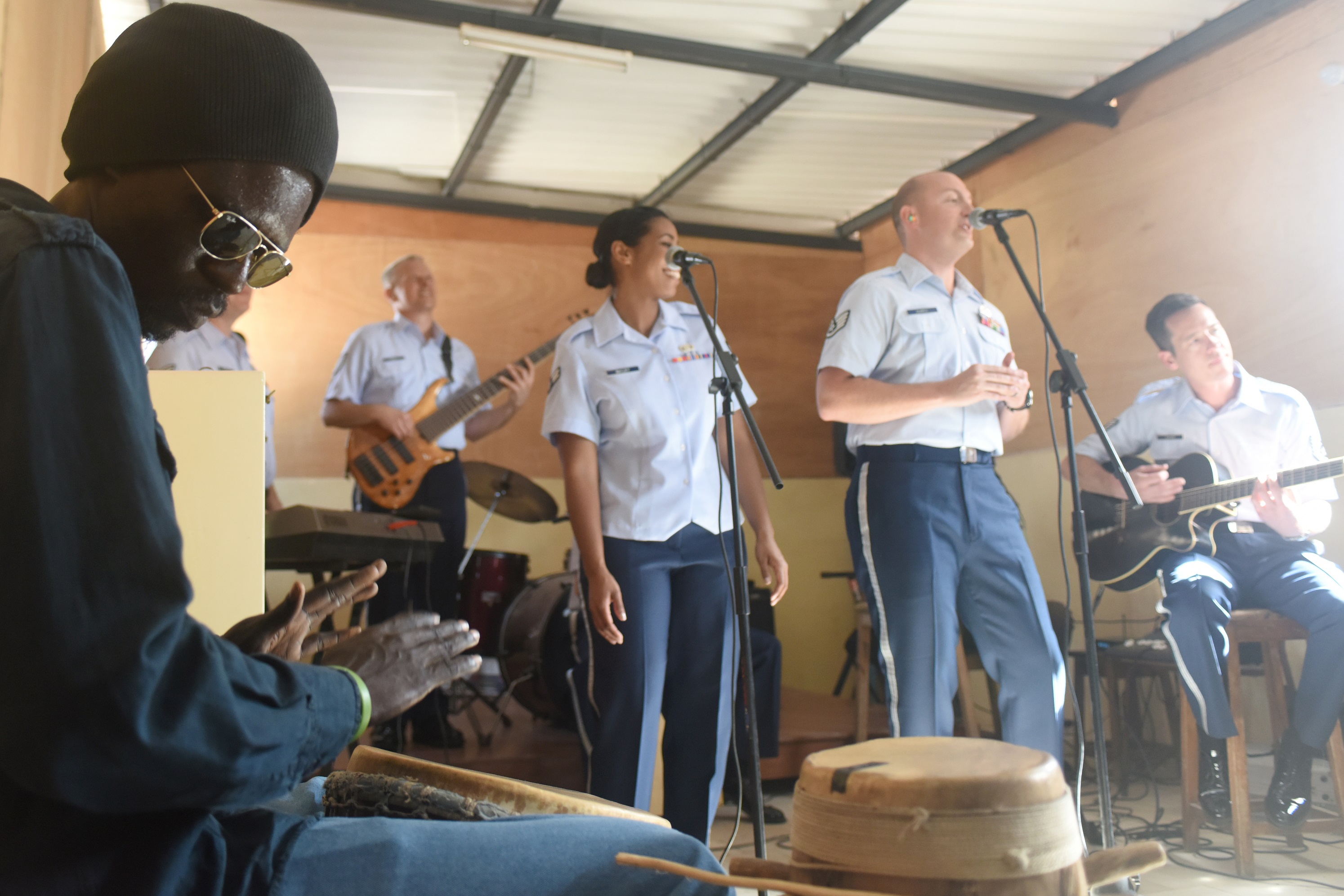 A student plays a drum along with the U.S. Air Forces in Europe Band at the National School of the Arts in Dakar, Senegal.