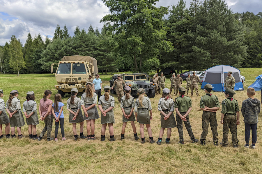 U.S. Army 1st Lt. Eduardo Santiago, detachment commander for the 266th Ordinance Company, a Reserve unit out of Puerto Rico, speaks with Polish scouts about his unit’s mission in support of Atlantic Resolve at Camp Watra near Osieczow, Poland.