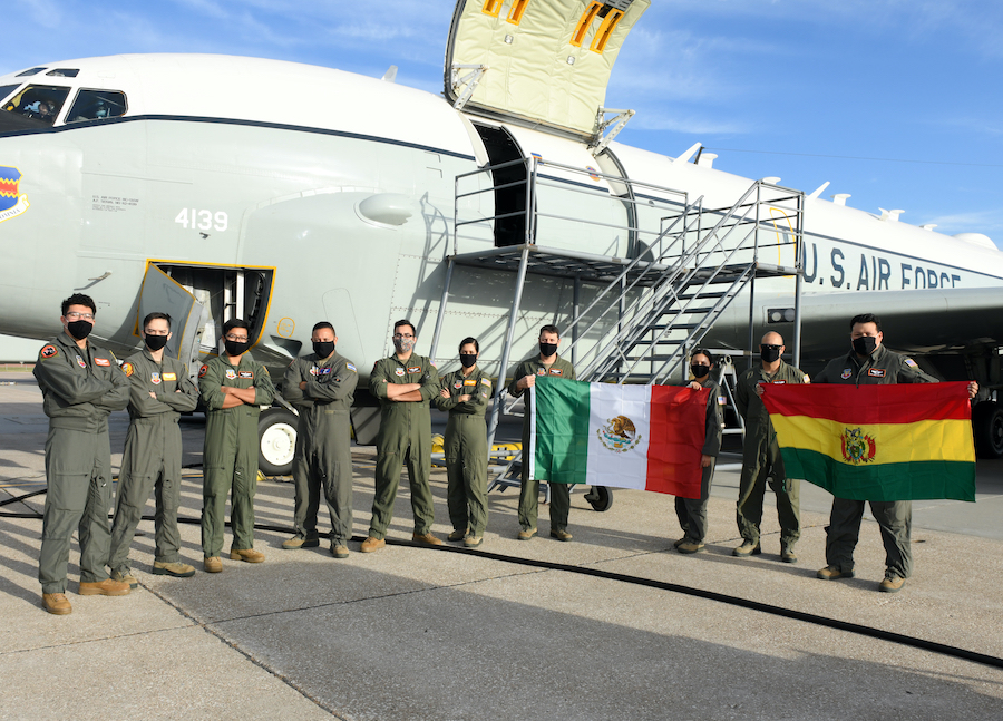 Ten Hispanic aircrew members of Team Offutt pose for a photo outside of a RC-135 aircraft prior to a training flight in honor of Hispanic Heritage Month. 