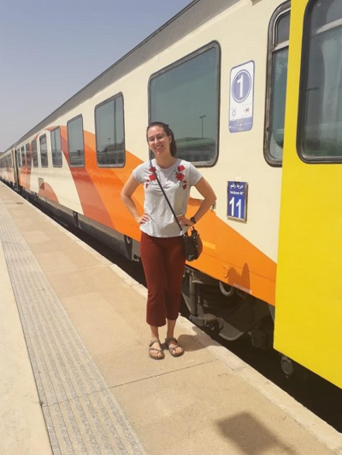 The author standing next to a train in Morocco. Photo: Jane Viviano