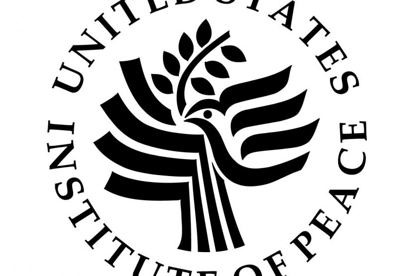 United States Institute of Peace Logo - swooping, artistic bird with olive branch, USIOP name circling the logo.
