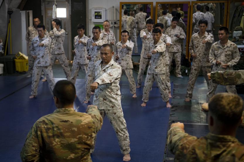 Japanese Ground Self-Defense Force Command Sgt. Maj. Kentaro Nakazato leads karate-style striking practice during a combatives exchange
