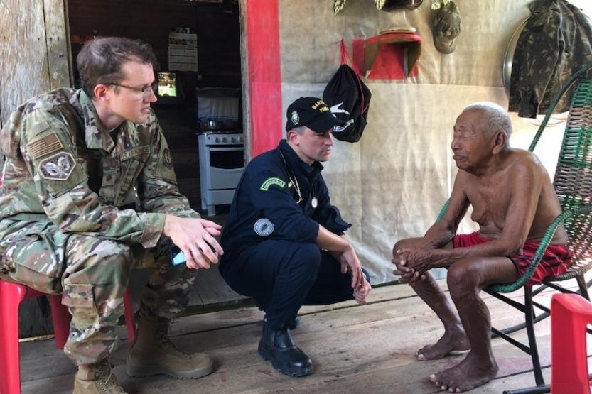 U.S. Air Force Maj. Joshua Shields, left, and Brazilian navy Lt. j.g. Guedes perform a patient evaluation during port visit in Sao Joao Batista, Brazil, Aug. 10, 2019.