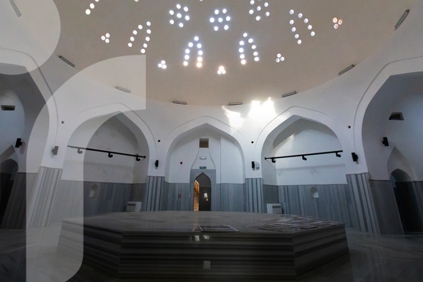 The inside of a Turkey Hammam with five arches and a domed ceiling with intracate skylights